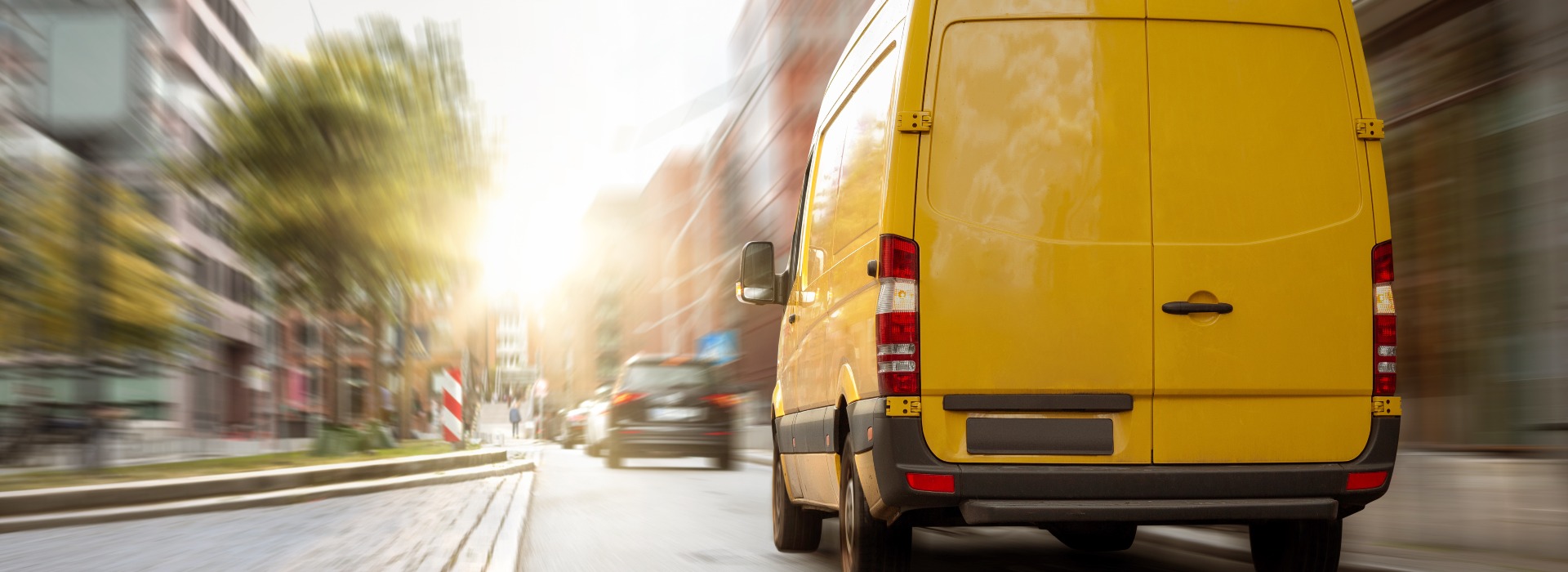 Delivery van driving in the city
